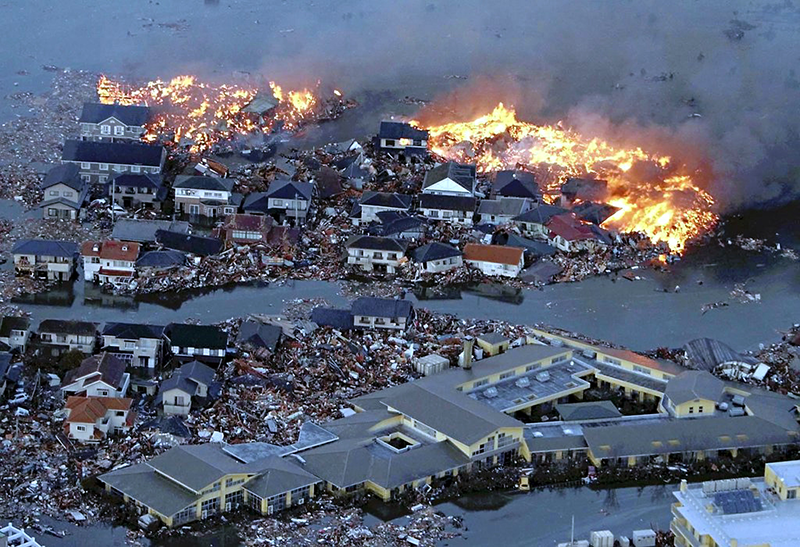 Houses in a flood, on fire