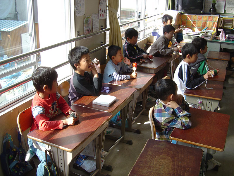 japanese students six boys in an elementary school classroom