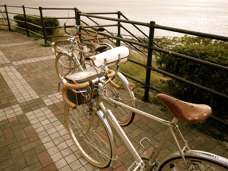 A bike parked by a river