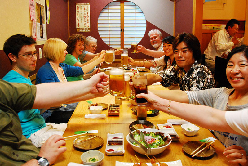 People drinking beer in a Japanese restaurant