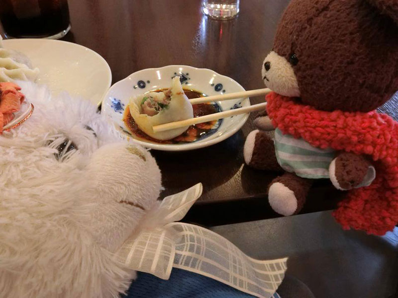 stuffed animals eating japanese food