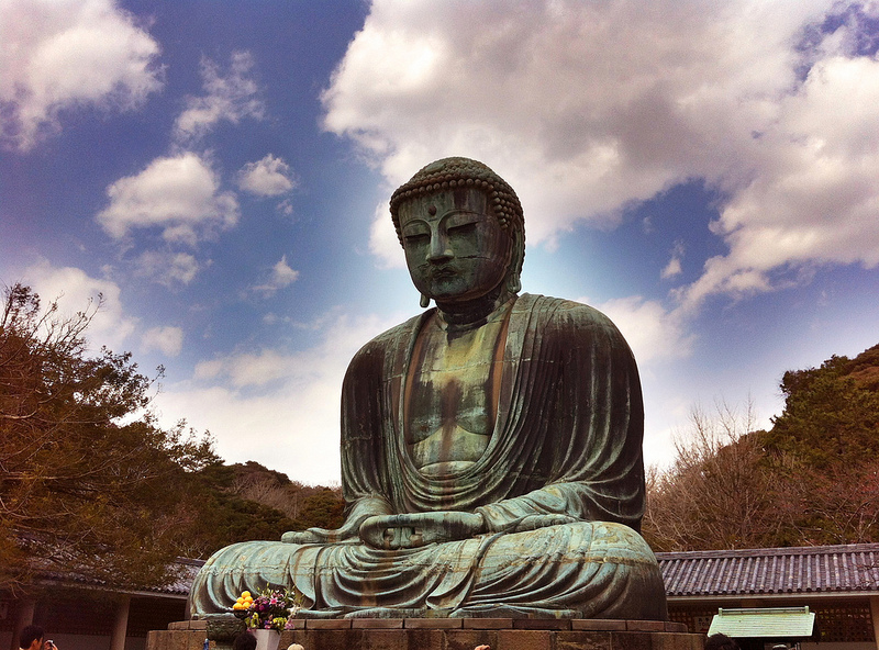 buddha statue in rock garden