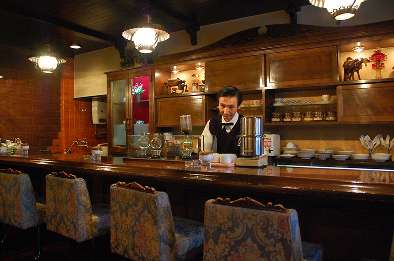 man behind counter at Japanese kissaten