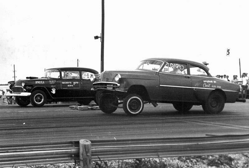 Two cars modified for drag racing in the sixties