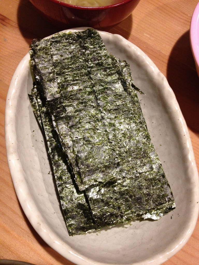 sheets of nori on a white plate