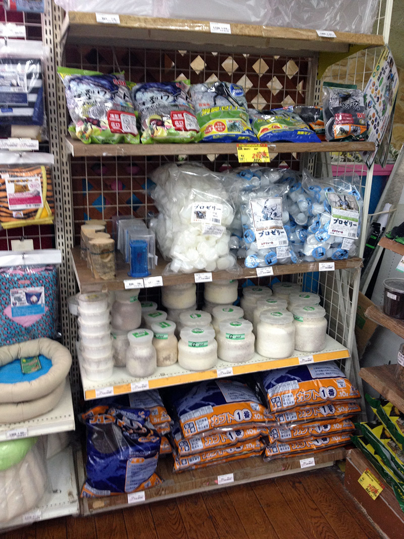 A shelf of products in a pet store