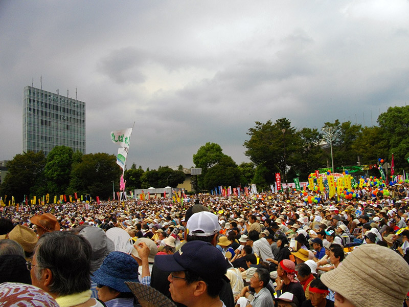 Group of protestors sitting together at a rally