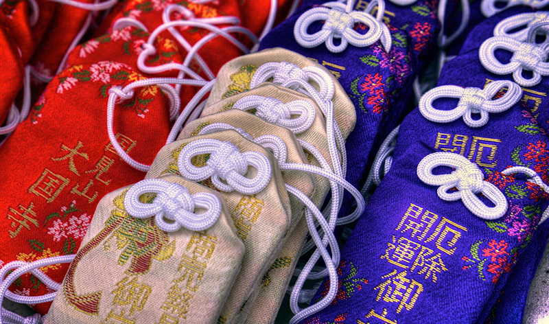 red blue and white omamori charms