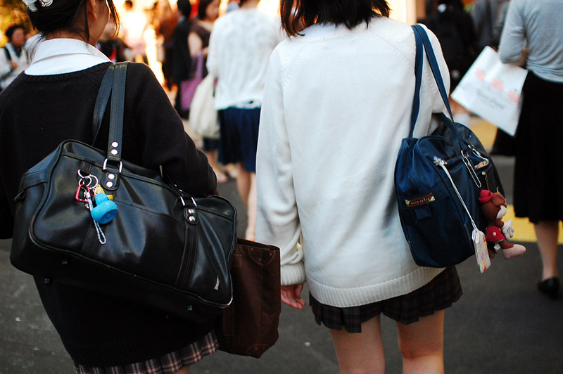 high school students with charms