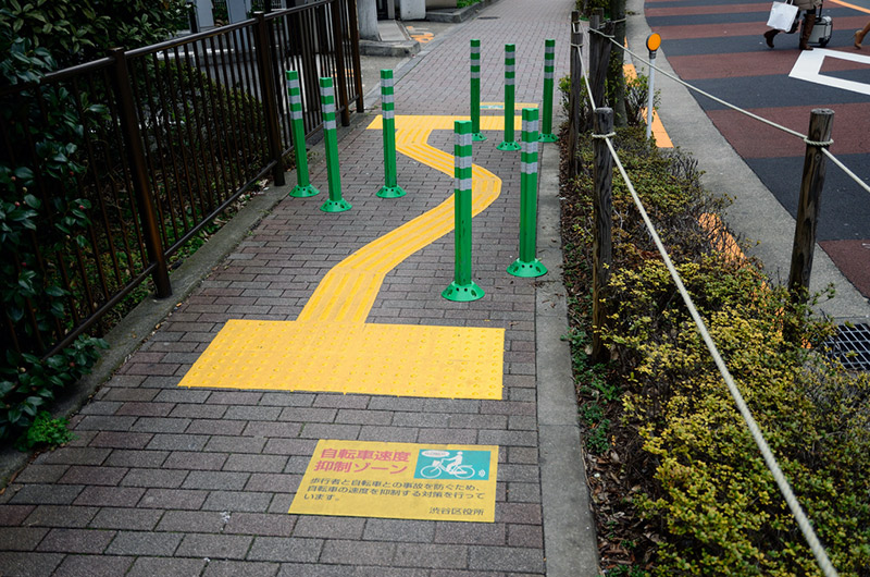 obstacles on bike path with markers for the disabled