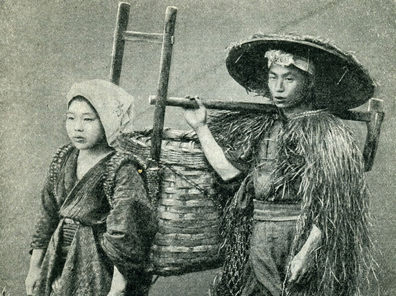 Black and white photograph of a man and women in farming clothes