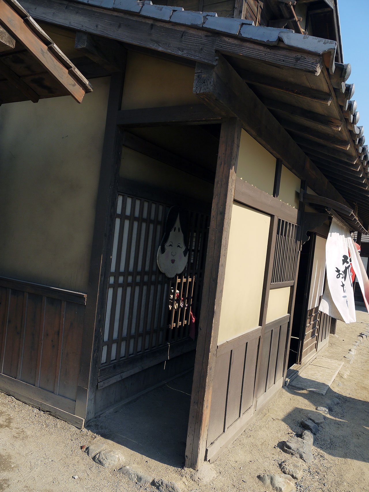 looking in a doorway historic japan woman's face