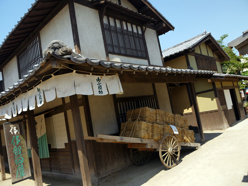 japanese building with hay cart outside