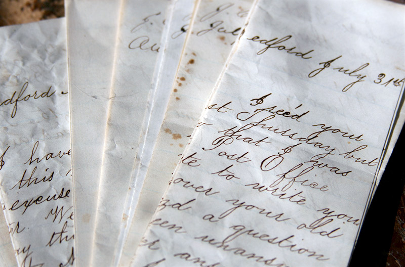 A pile of weathered handwritten letters