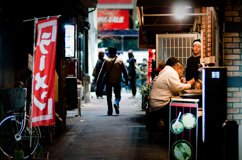 various ramen stands on a small street japan