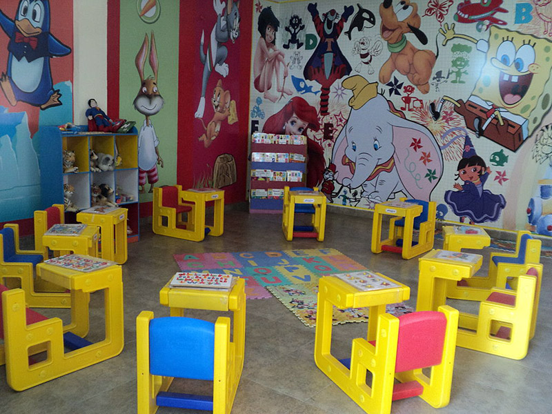 Tables and rubber mats for kindergarteners