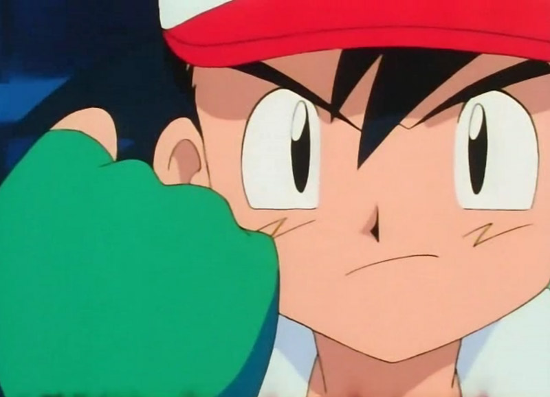 Ash from Pokemon with his fist in front of his face