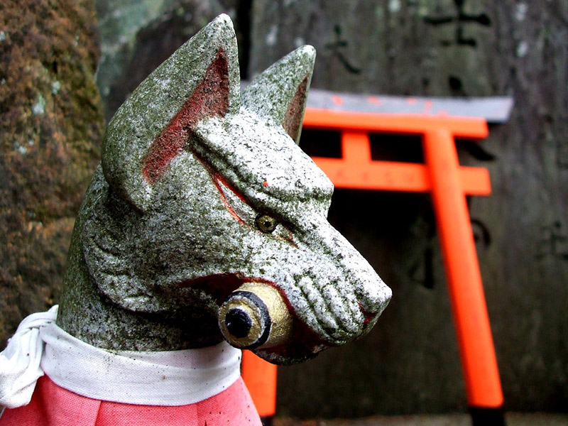 kitsune statue at an inari shrine