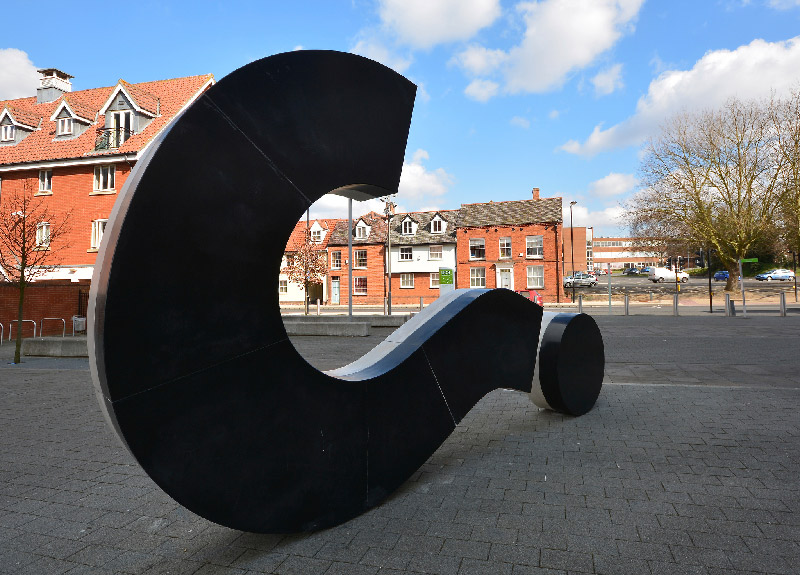 sideways question mark sculpture