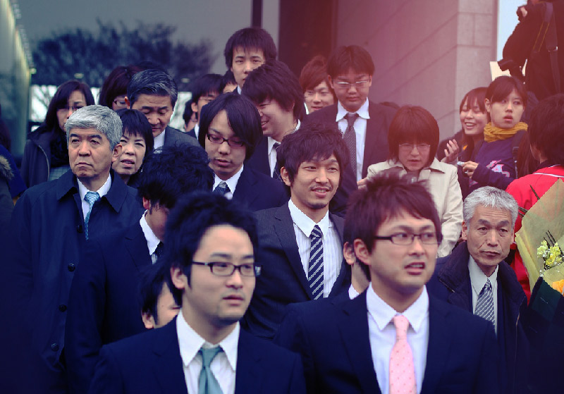 crowd of Japanese businessmen and women