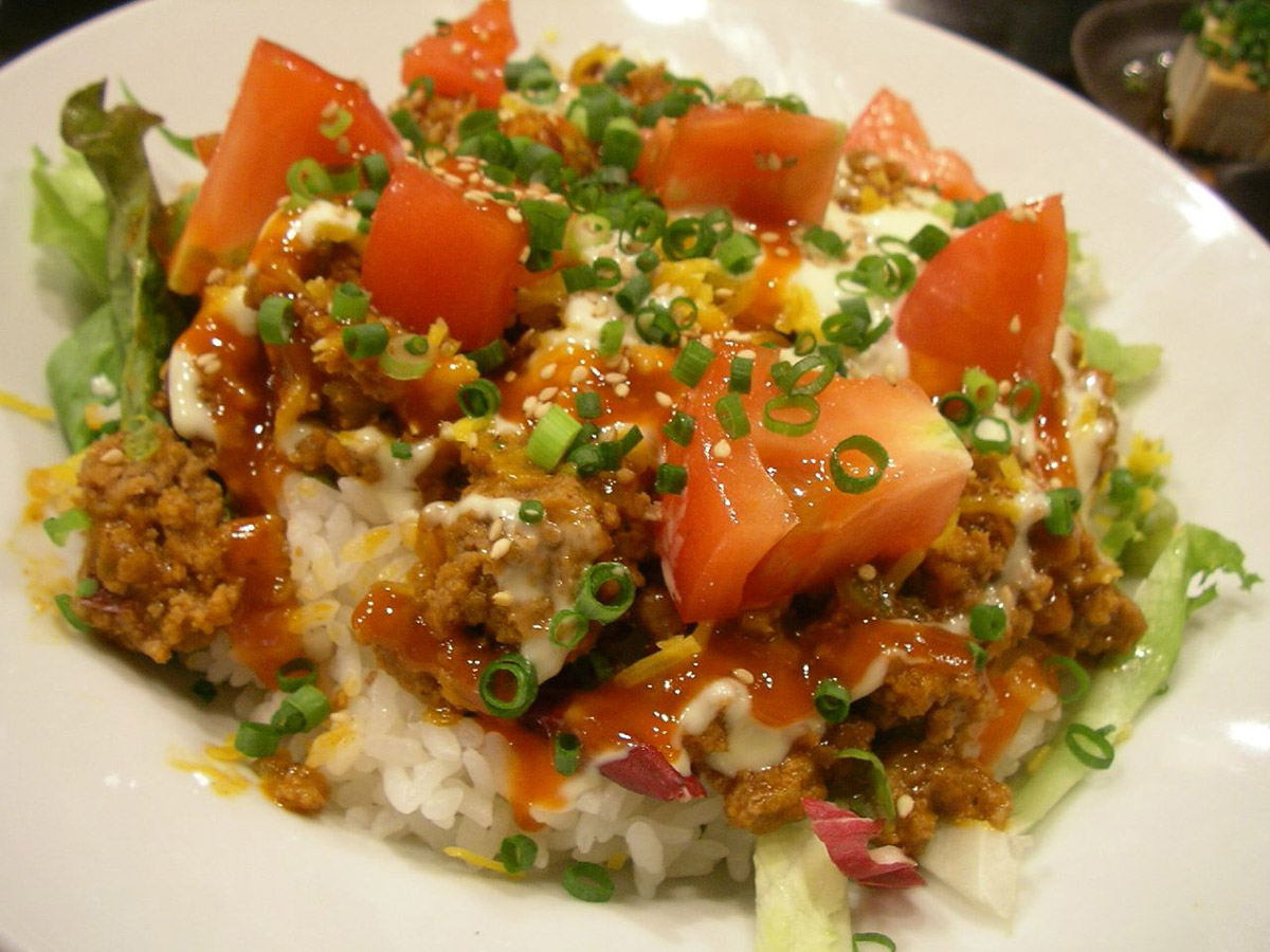 rice topped with beef and tomato and cheese in japan