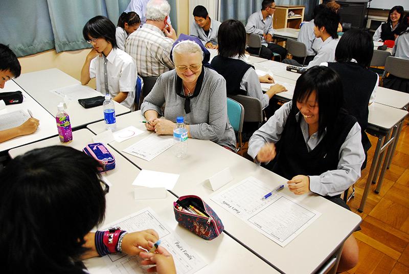 An elderly foreign woman teaching at Japanese night school