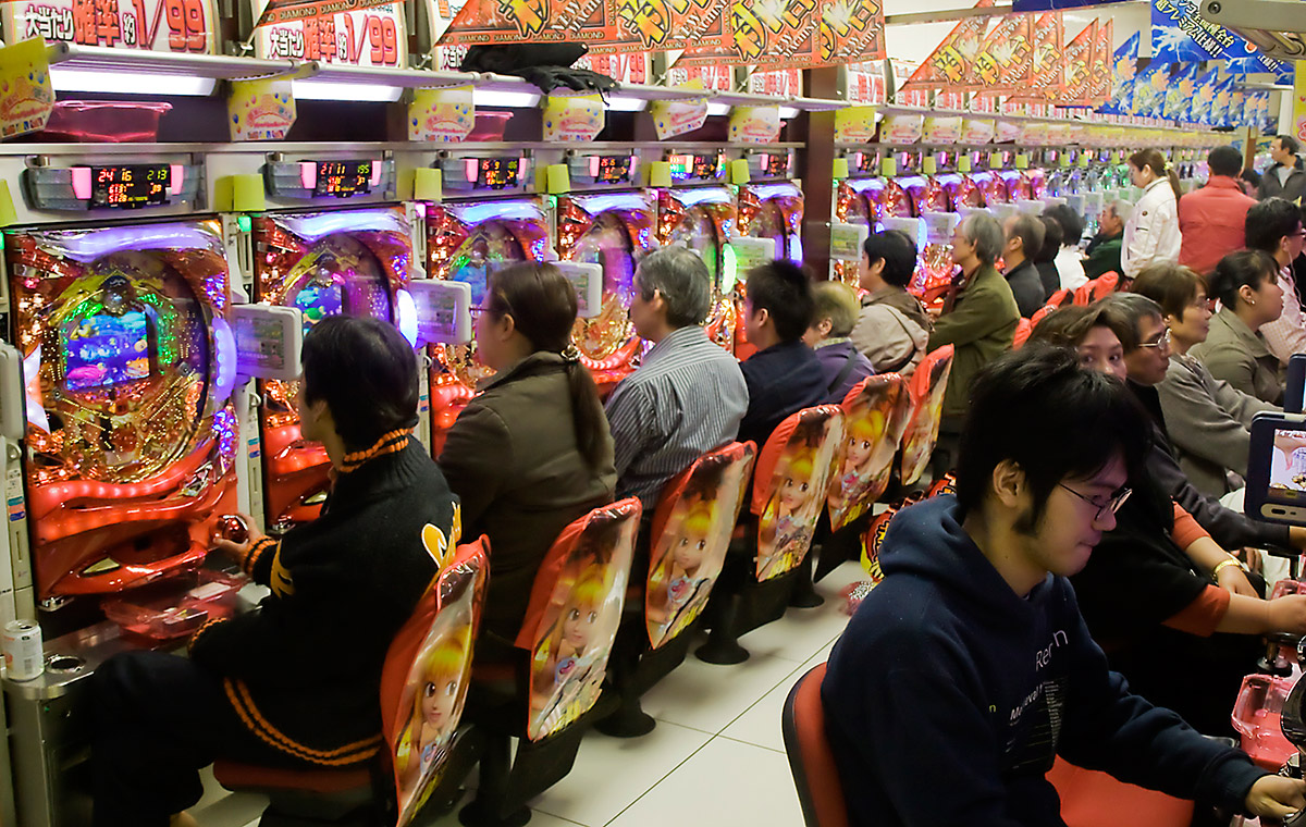 Japanese people playing in a pachinko parlor