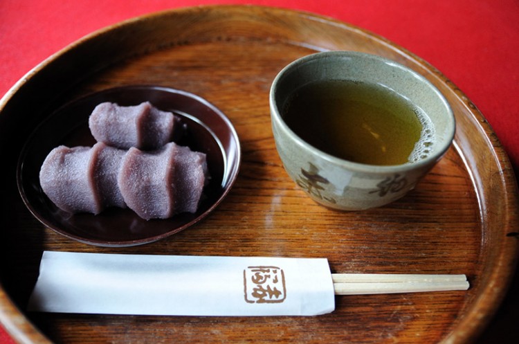 A cup of green tea and Japanese sweets with red bean paste