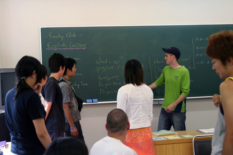 foreign teacher in front of Japanese students