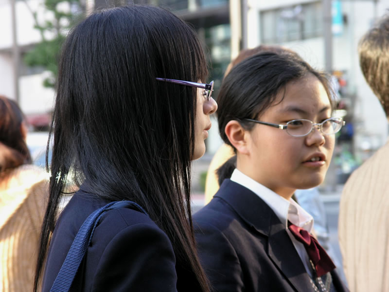 High school students wearing wire frame glasses