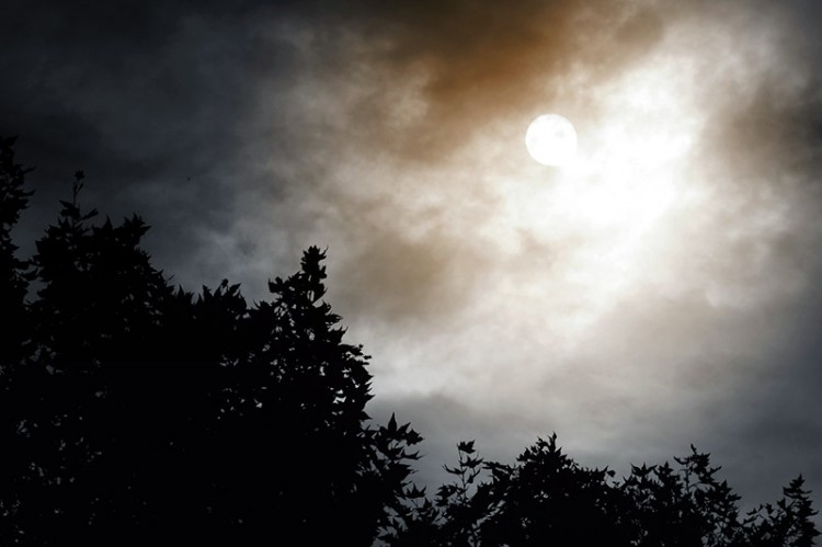 moon behind clouds