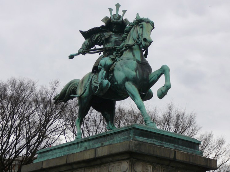 A statue of a mounted samurai