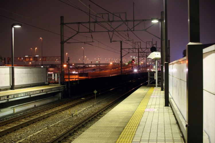 train station platform and tracks at night