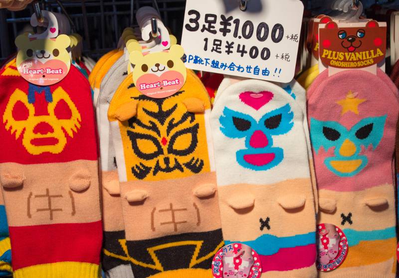 Luchador-printed socks with little arm nubs