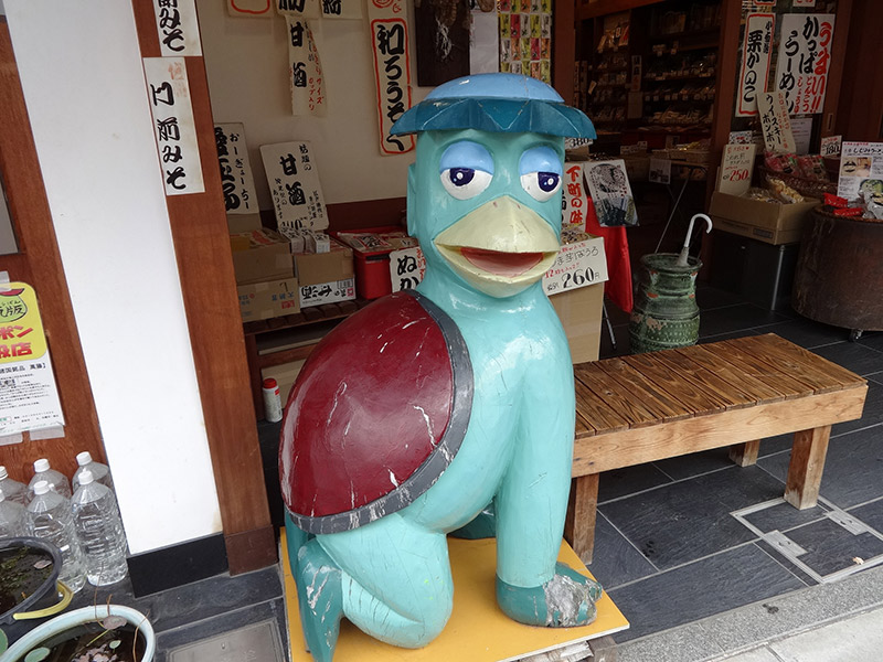 japanese kappa statue at storefront