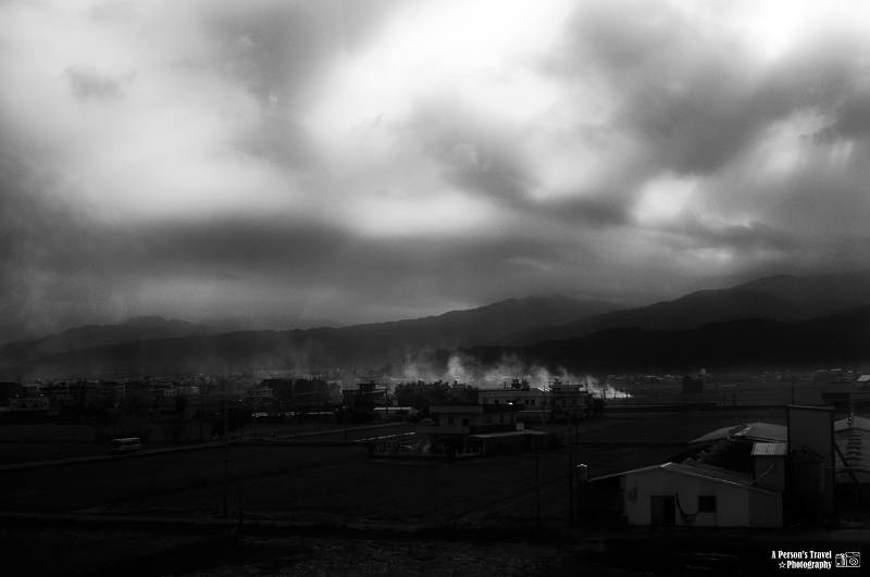 Black and white photo of a gloomy Japanese town