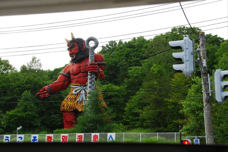 A large oni statue at a train station in Noboribetsu