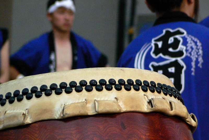 taiko drum with men in background