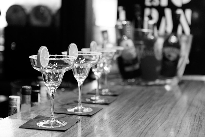 black & white photo of margarita glasses