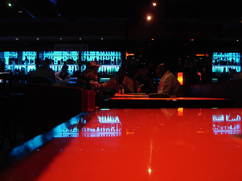 patrons in dimly light bar