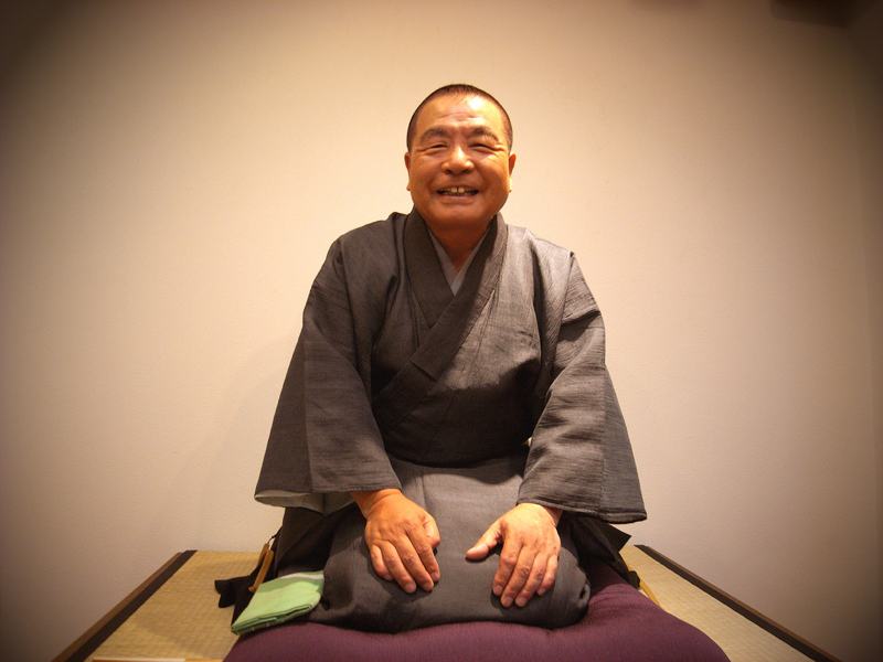 rakugo man sitting and smiling