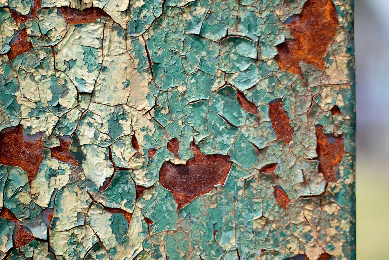 wabi-sabi green wall cracked with rust