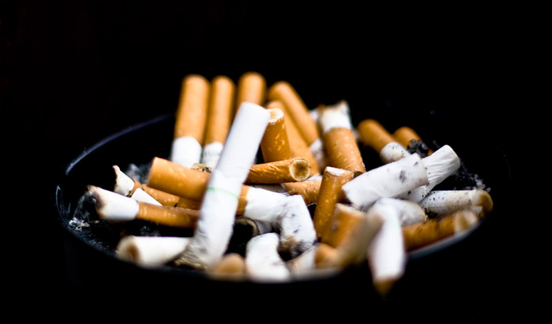 An ashtray with used cigarettes