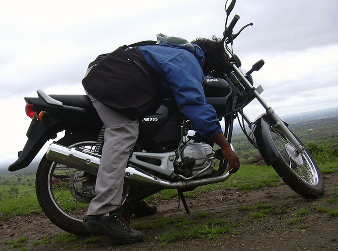 man slumped on motorcycle