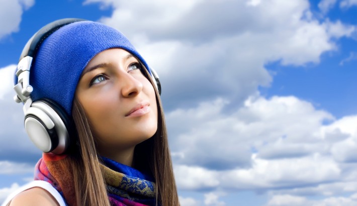 Girl with headphones listening