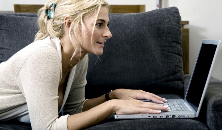 woman on couch with laptop