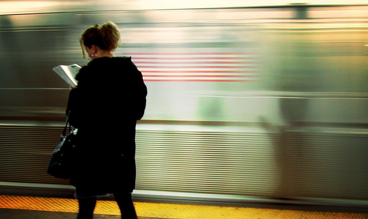 girl reading on the subway