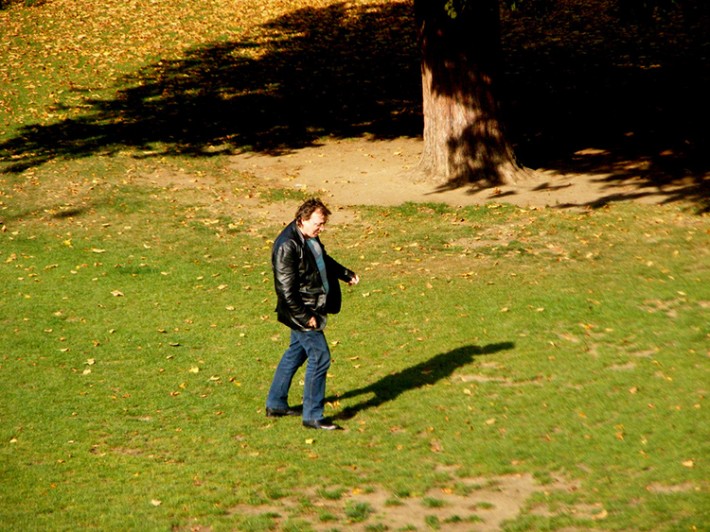 middle aged man leather jacket talking to himself