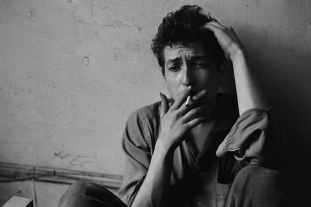 young Bob Dylan smoking a cigarette