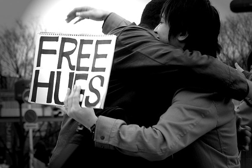 black and white photo two people hugging